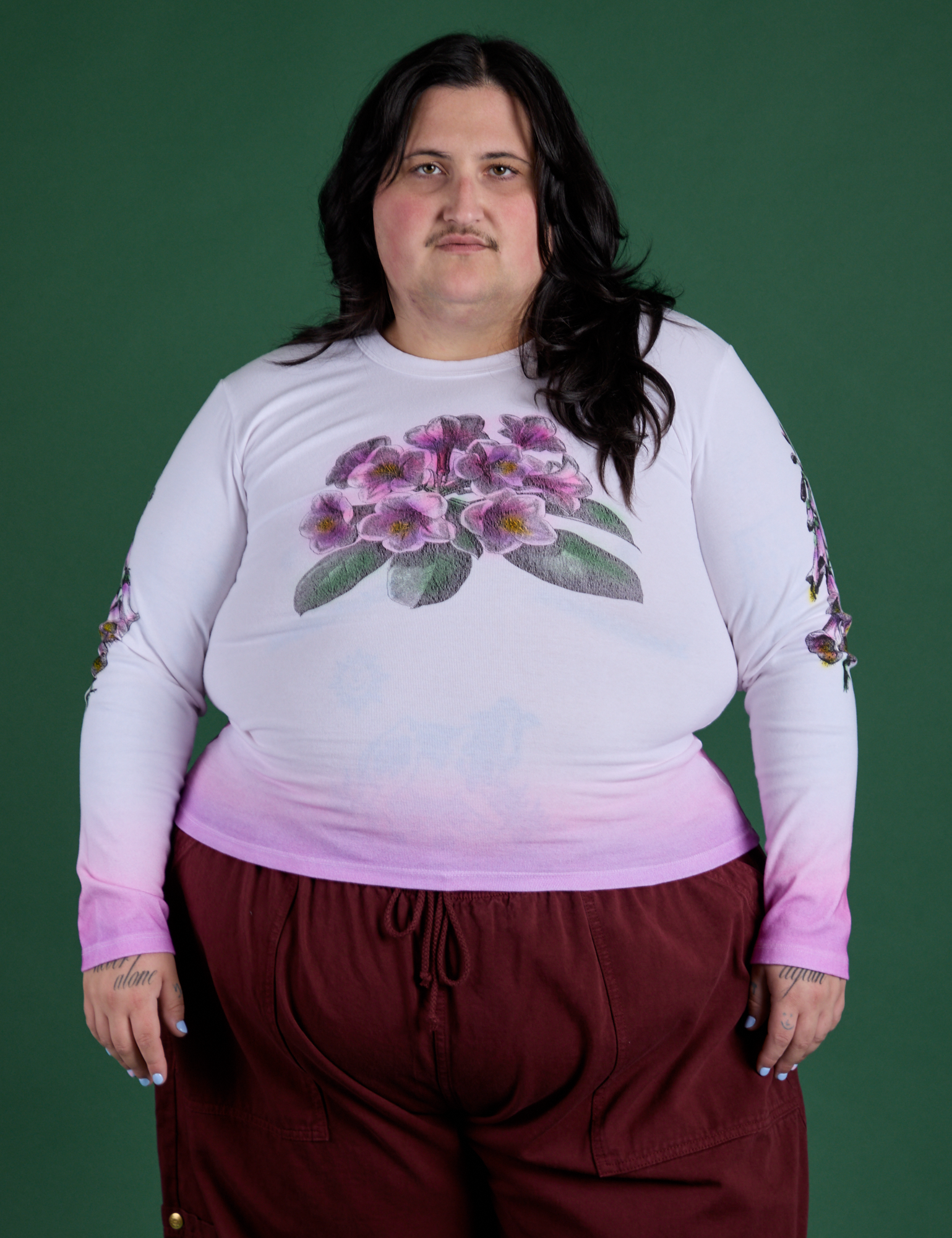 Sam is 5’10” and wearing XL Floral Long Sleeve Baby Tee in Pink