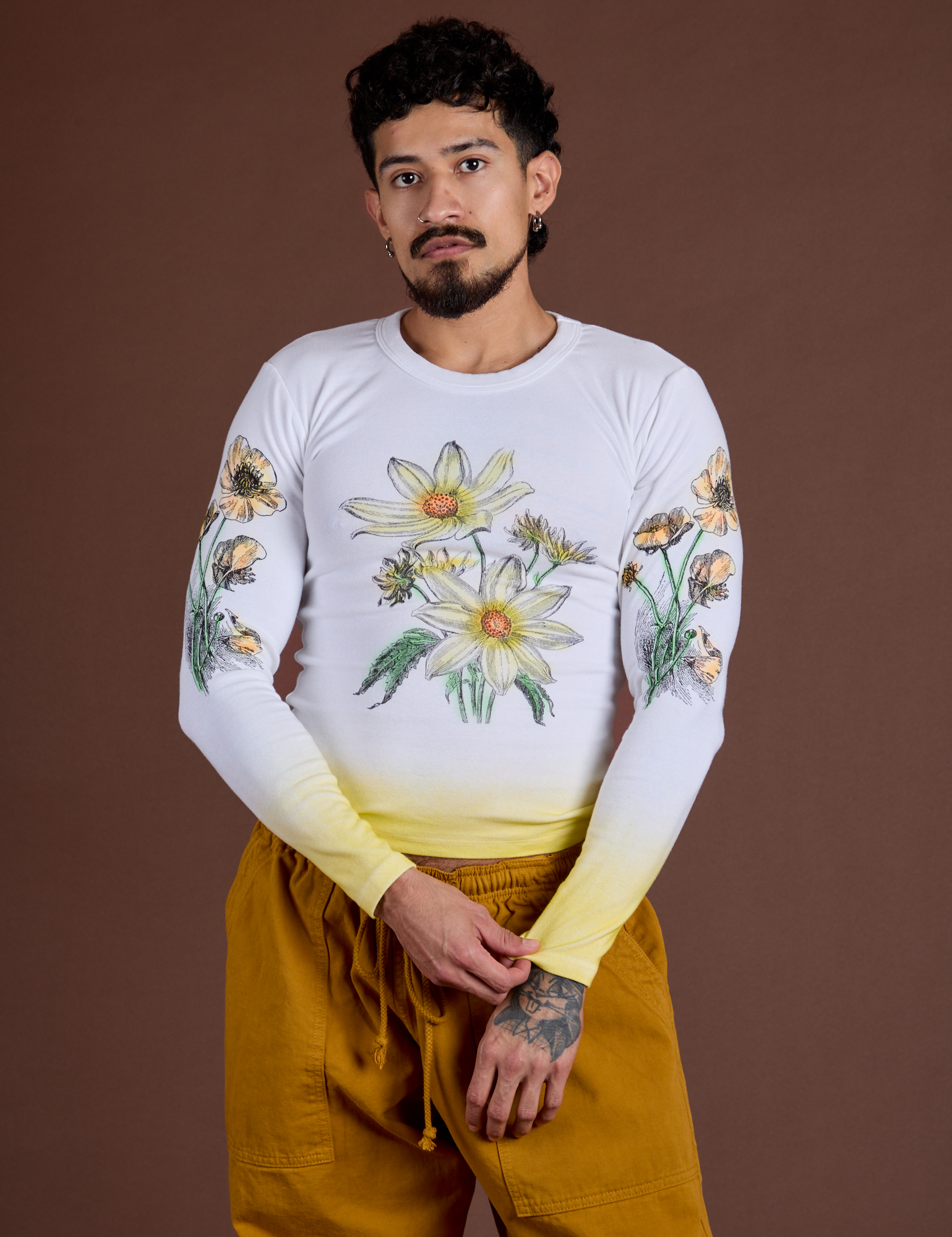 Jesse is 5’7” and wearing S Floral Long Sleeve Baby Tee in Yellow