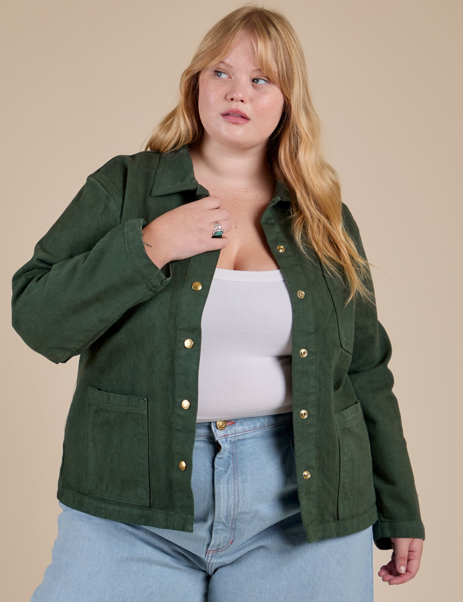 Juliet is 5'8" and wearing L Denim Work Jacket in Swamp Green