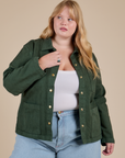 Juliet is 5'8" and wearing L Denim Work Jacket in Swamp Green