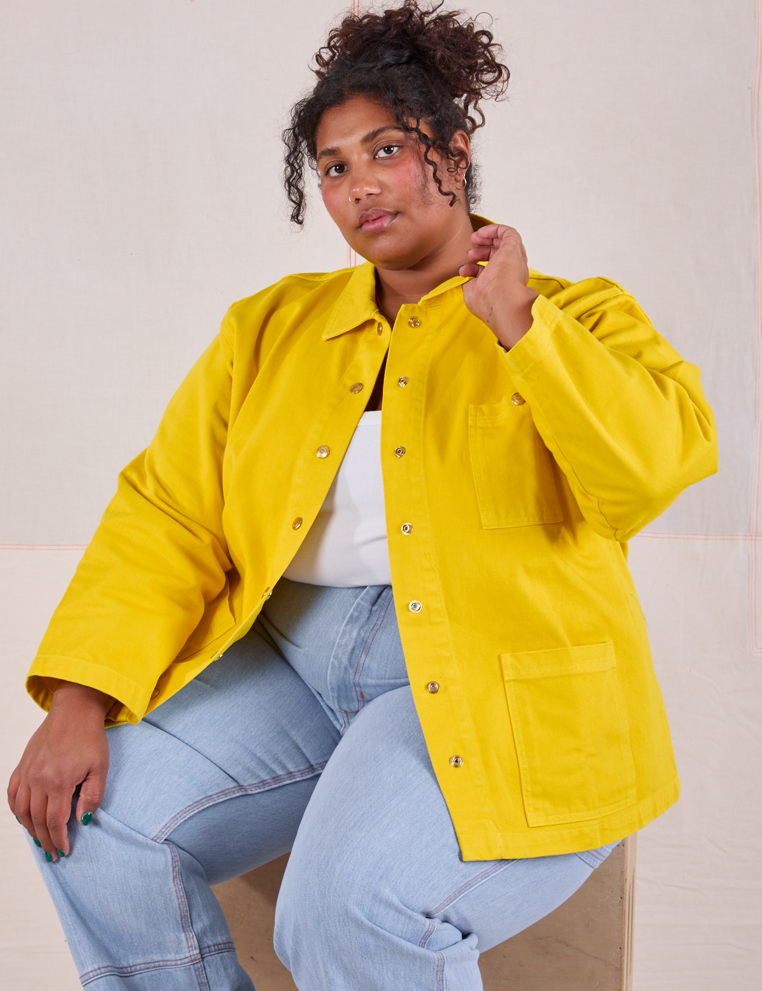 Morgan is wearing Denim Work Jacket in Golden Yellow and light wash Carpenter jeans