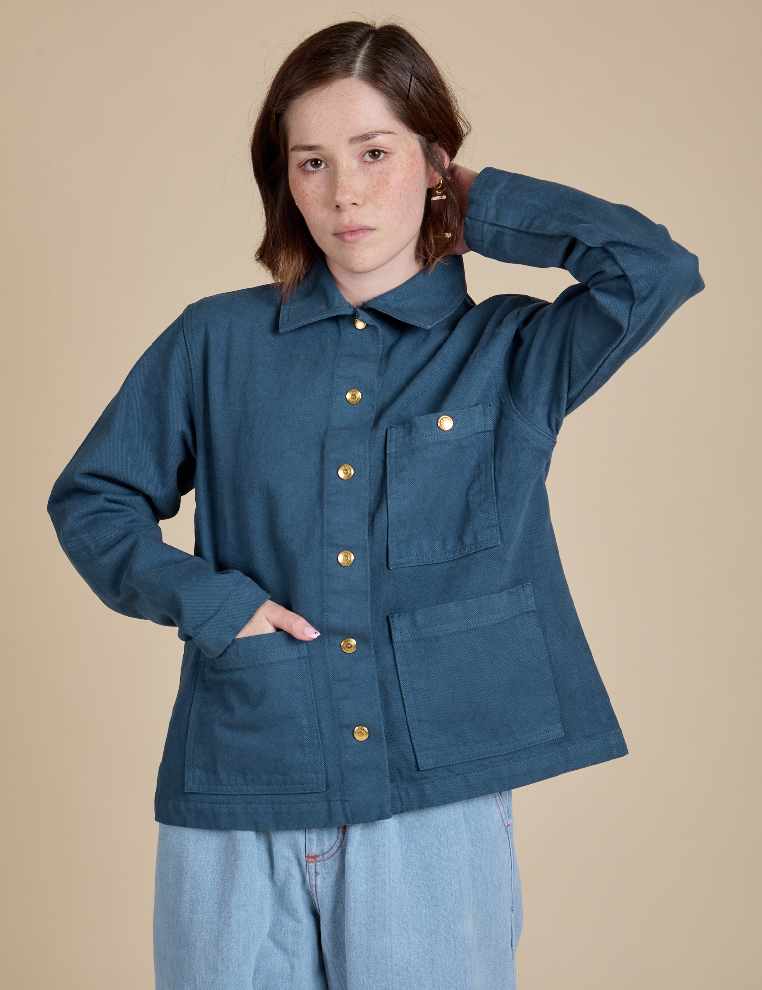 Hana is wearing a buttoned up Denim Work Jacket in French Blue