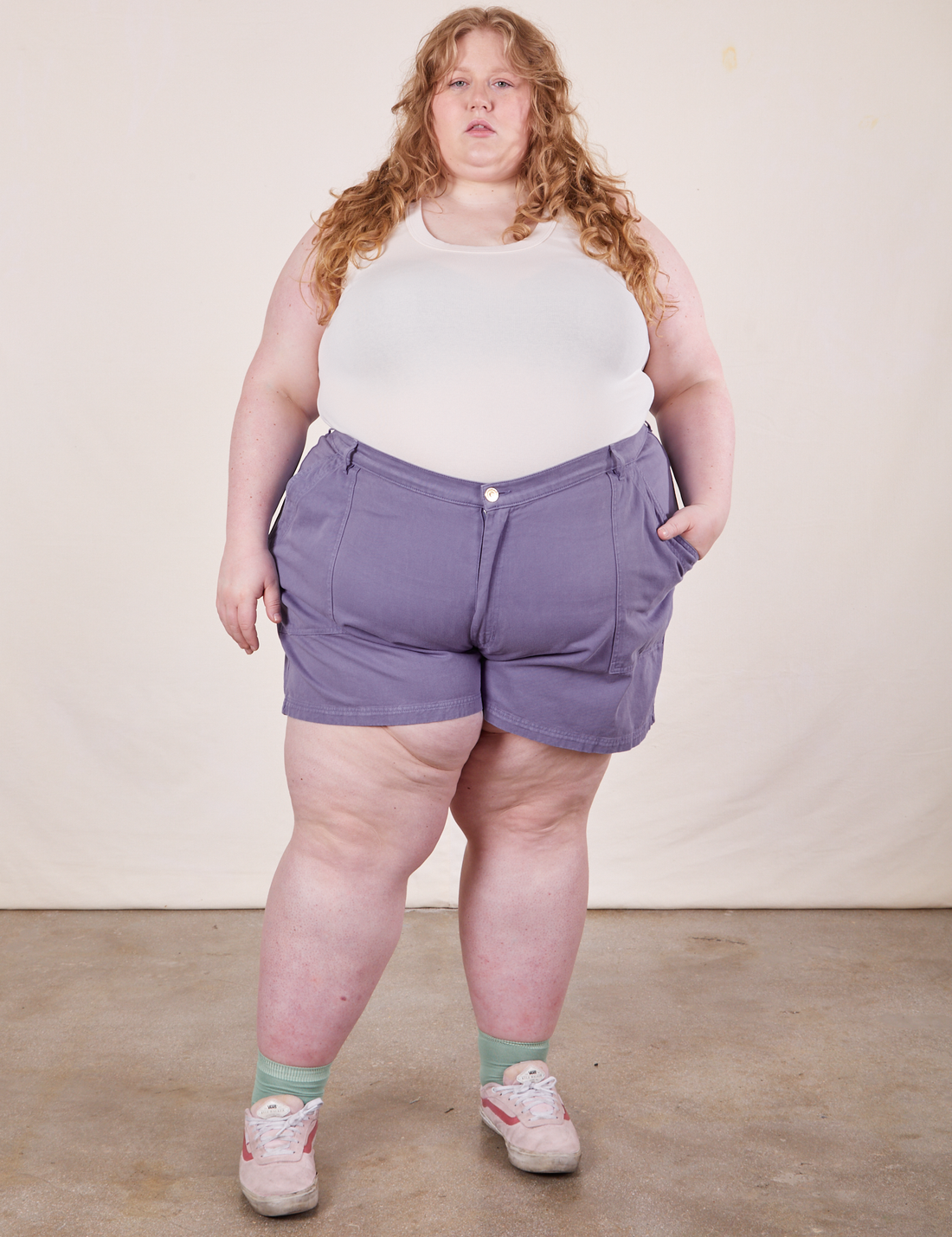 Catie is 5'11" and wearing size 5XL Classic Work Shorts in Faded Grape paired with a vintage off-white Tank Top