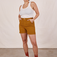 Tiara is 5'4" and wearing size S Classic Work Shorts in Spicy Mustard paired with vintage off-white Tank Top