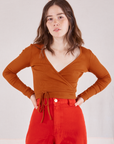 Hana is 5'3" and wearing size 1  Wrap Top in Burnt Terracotta