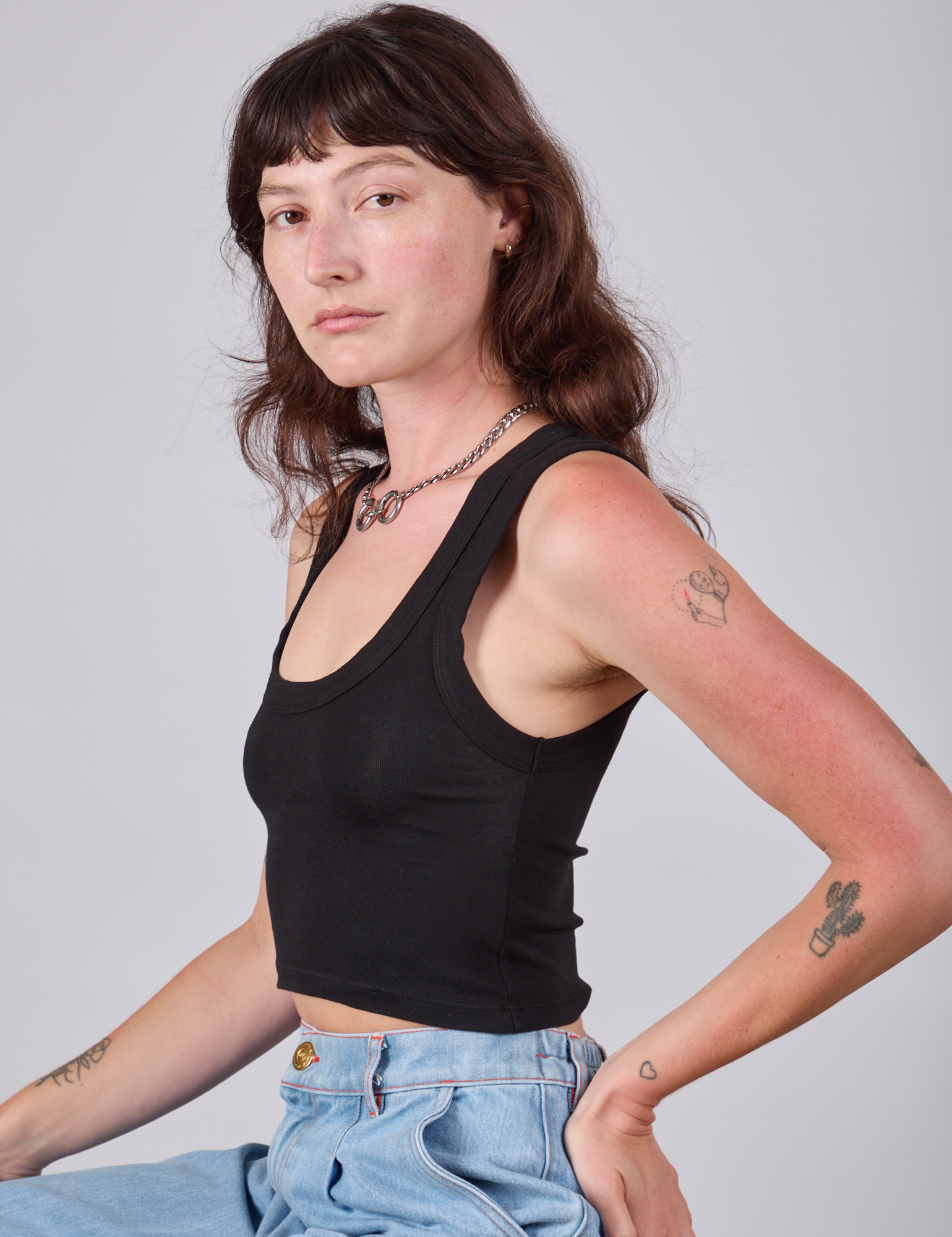 Cropped Tank Top in Basic Black side view on Alex