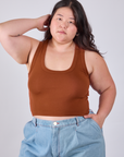 Ashley is 5'7" and wearing L Cropped Tank Top in Burnt Terracotta