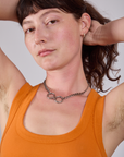 Cropped Tank Top in Creamsicle Orange neckline close up on Alex