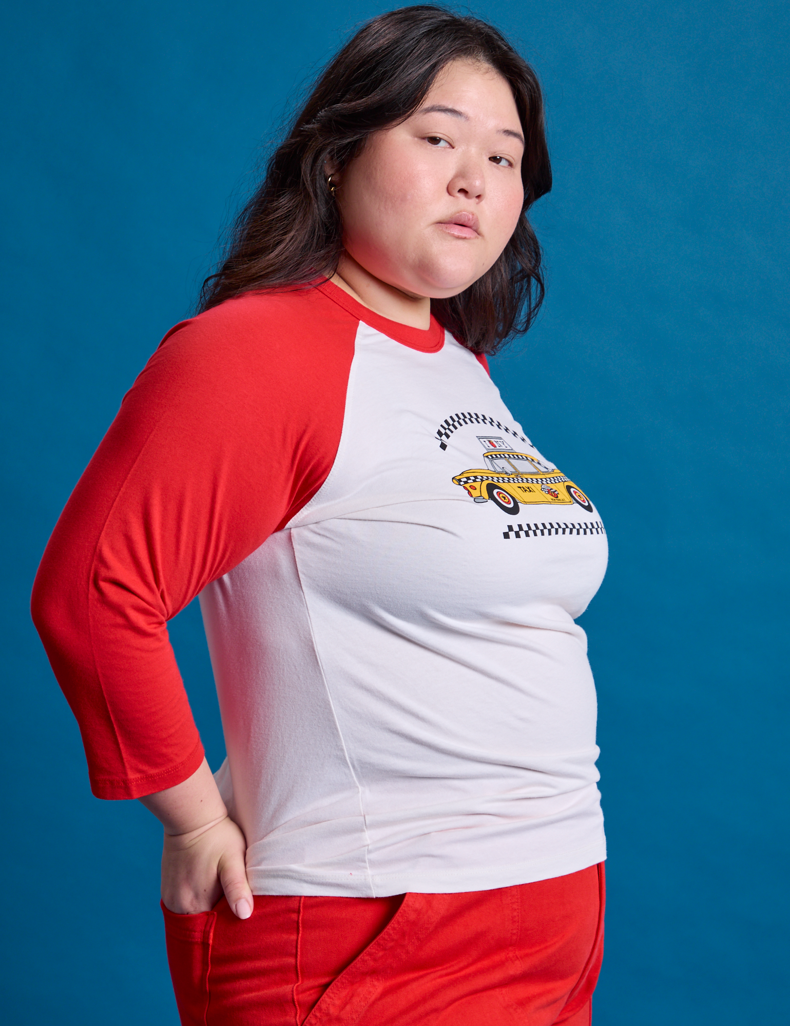 Taxi Raglan Tee in NYC side view on Ashley