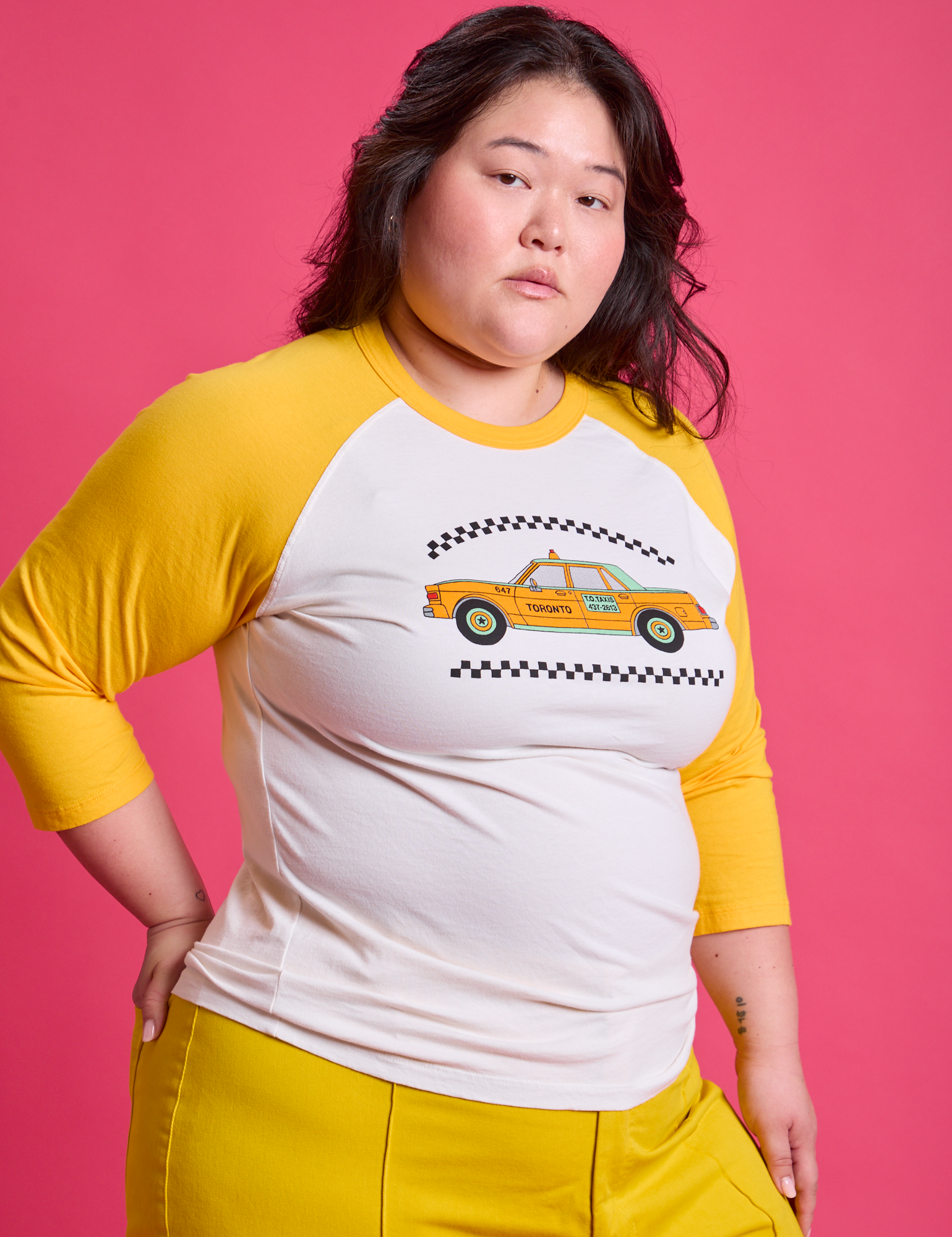 Taxi Raglan Tee in Toronto angled front view on Ashley