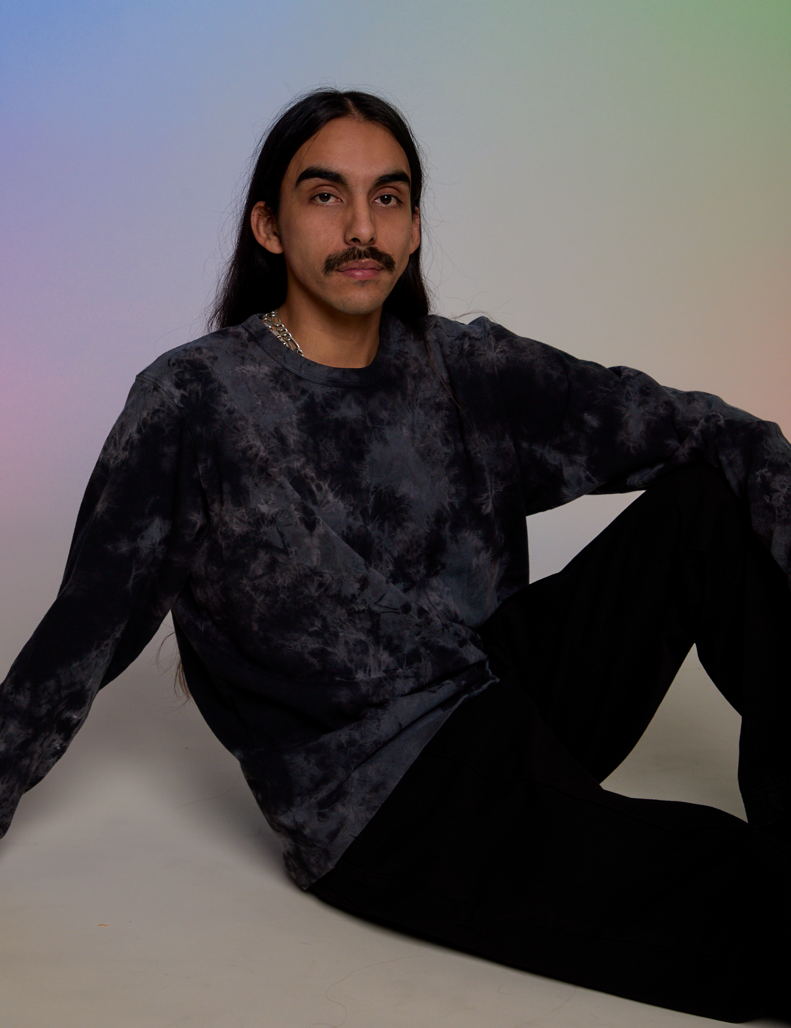 Anthony is wearing Magic Waters Long Sleeve Burly Tee in Black