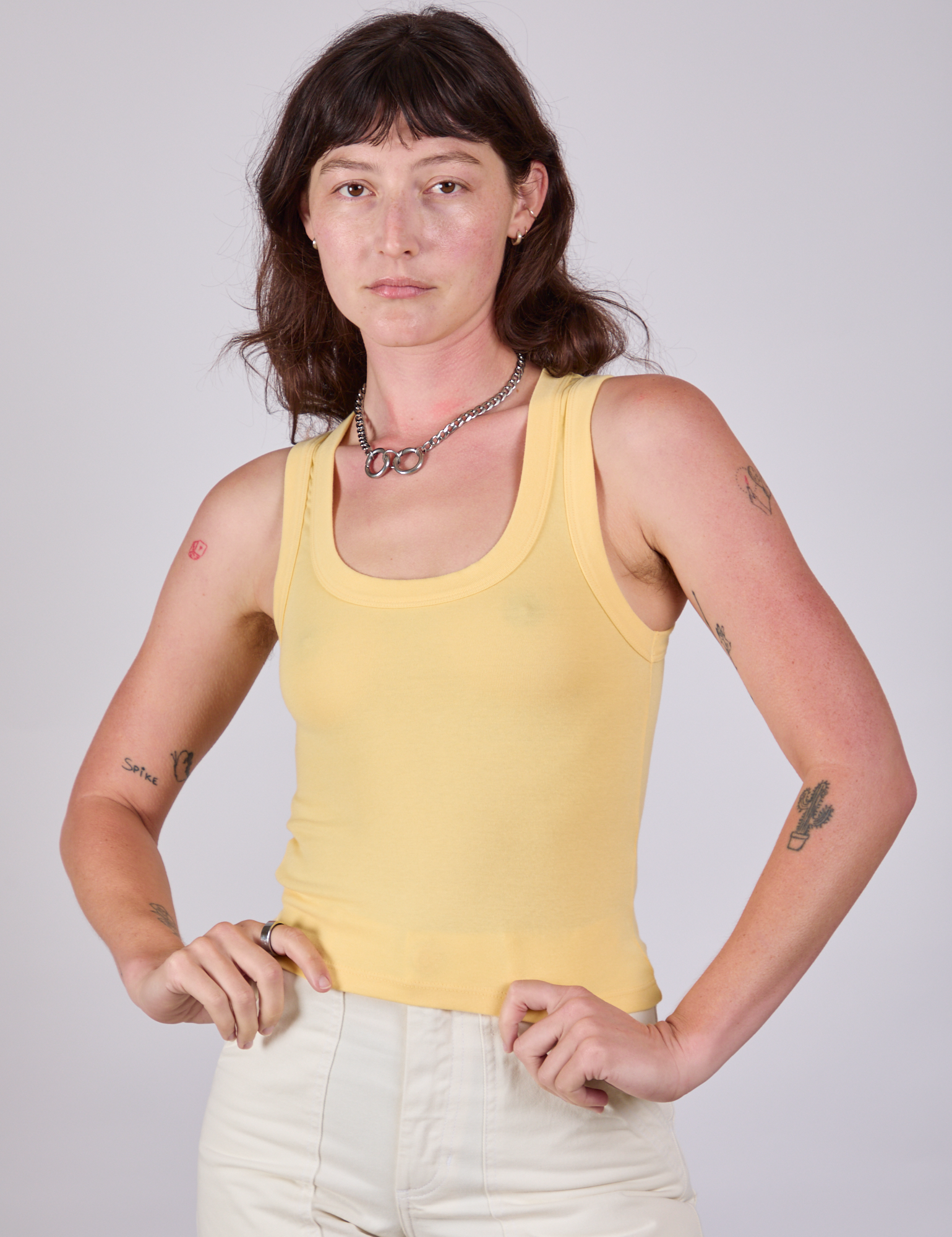 Alex is 5&#39;8&quot; and wearing P Tank Top in Butter Yellow
