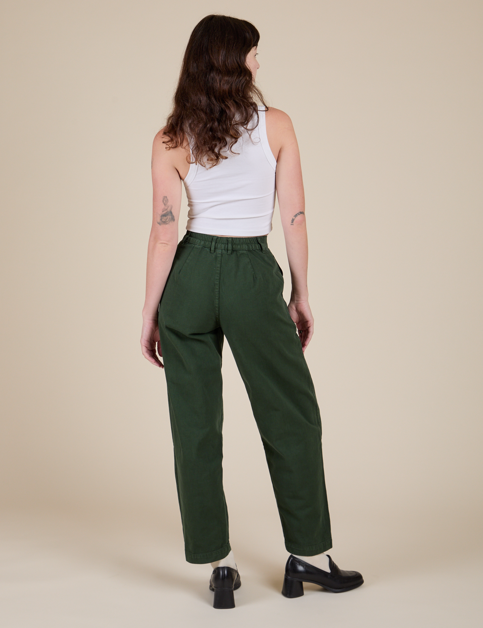 Back view of Heavyweight Trousers in Swamp Green and Cropped Tank in Vintage Tee White on Alex
