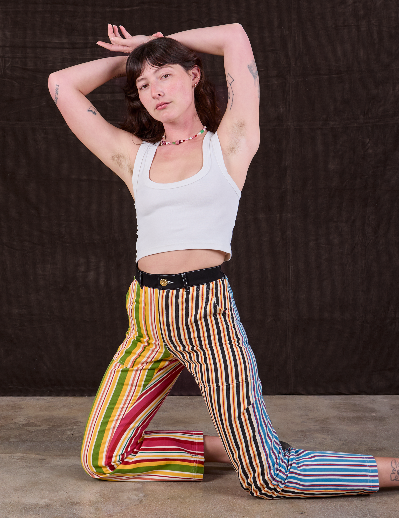 Alex is wearing Mixed Stripe Work Pants and Cropped Tank in vintage tee off-white