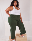 Side view of Action Pants in Swamp Green and Cropped Tank in vintage tee off-white on Morgan