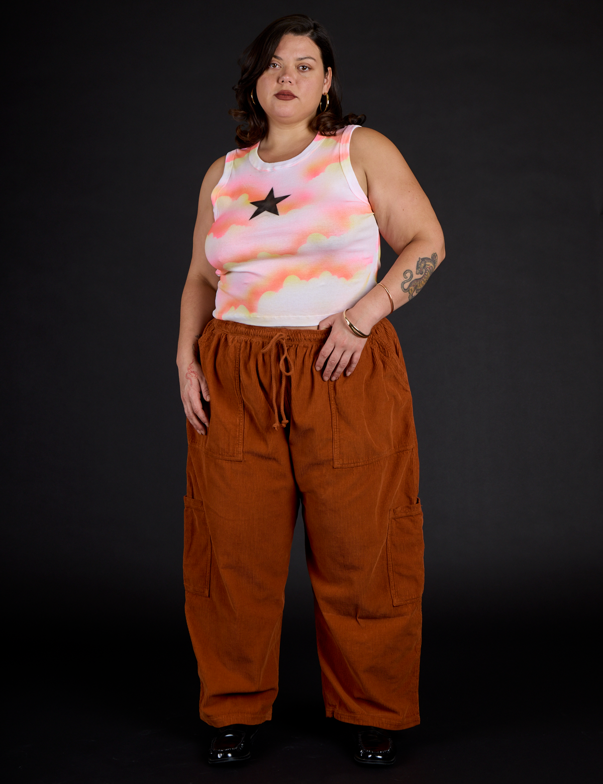 Kristen in the Black Star Airbrush Muscle Tee and Burnt Terracotta Corduroy Drop Pocket Cargo Pant