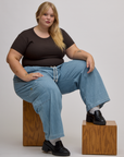 Baby Tee in Espresso Brown and light wash denim drop pocket pants on Juliet