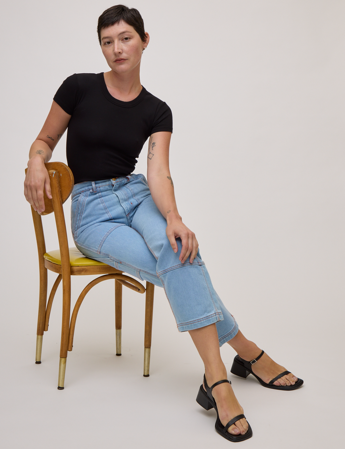 Baby Tee in Basic Black and light wash carpenter jeans on Alex