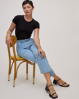 Baby Tee in Basic Black and light wash carpenter jeans on Alex