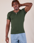 Isaac is 5'10" and wearing L Baby Tee in Swamp Green