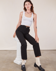 Alex is wearing Work Pants in Black and Cropped Tank in vintage tee off-white