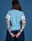 Painted Burly Tee in Baby Blue back view on Sydney
