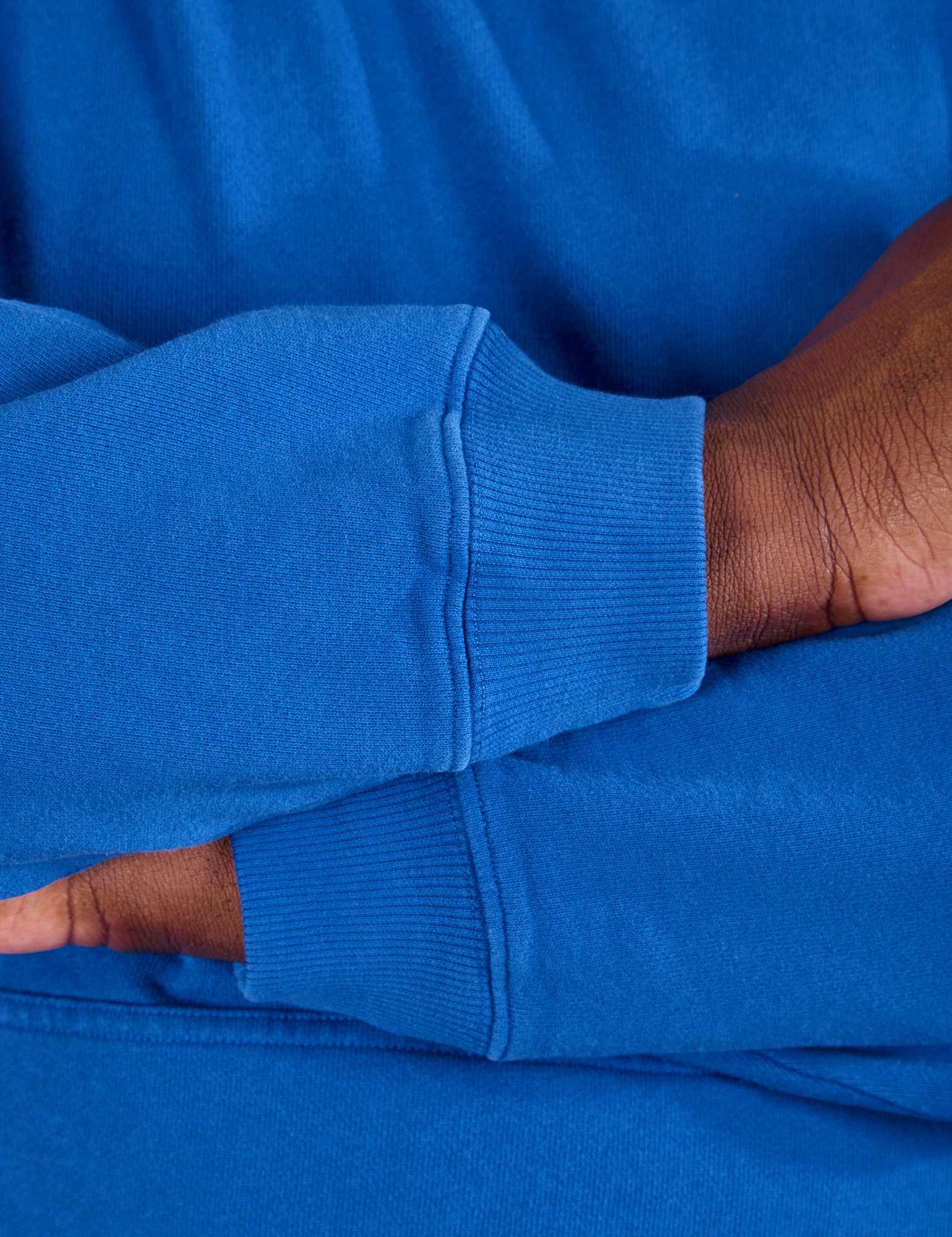 Oversized Hoodie in Royal Blue sleeve close up on Elijah