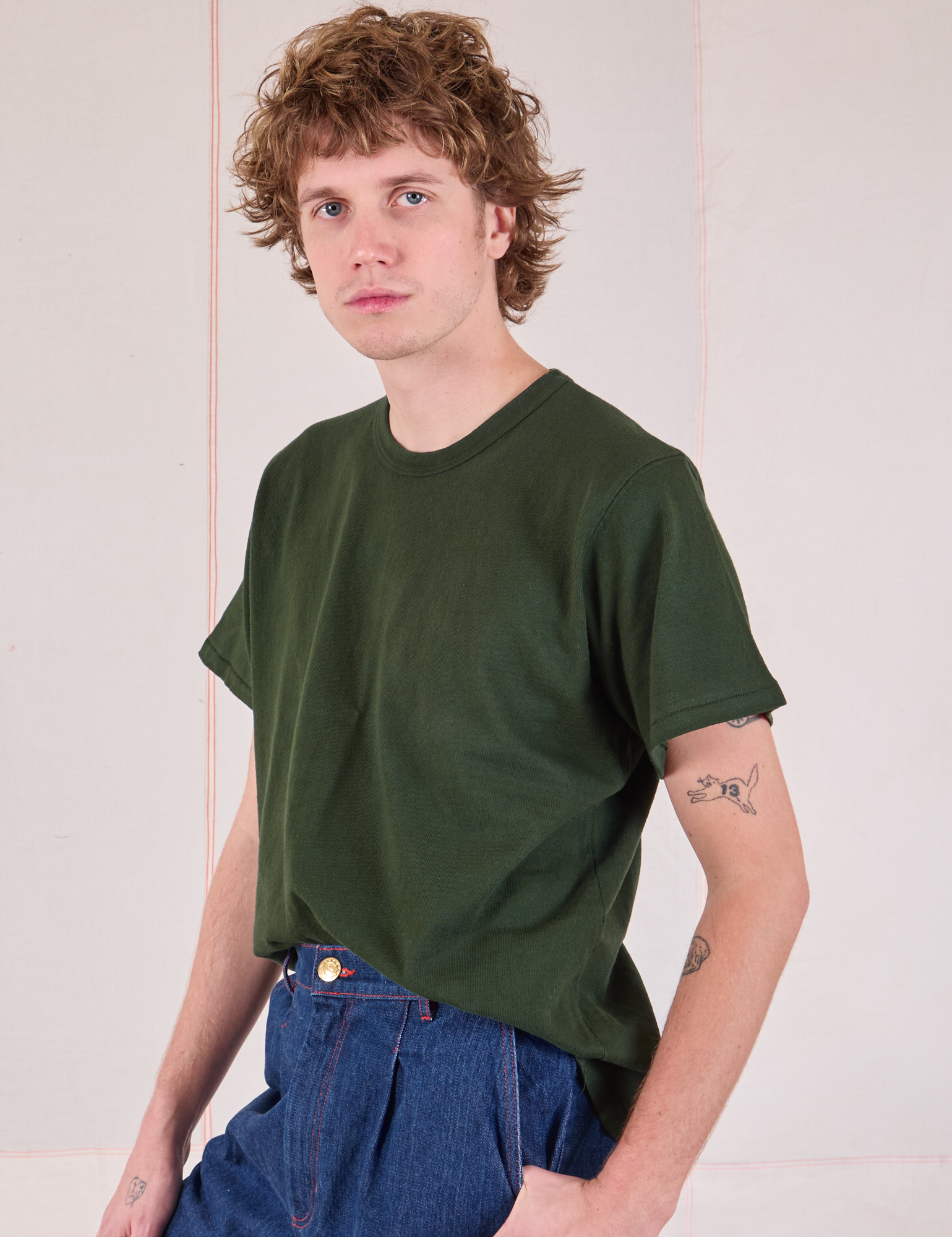 Burly Tee in Swamp Green angled front view on Quinn