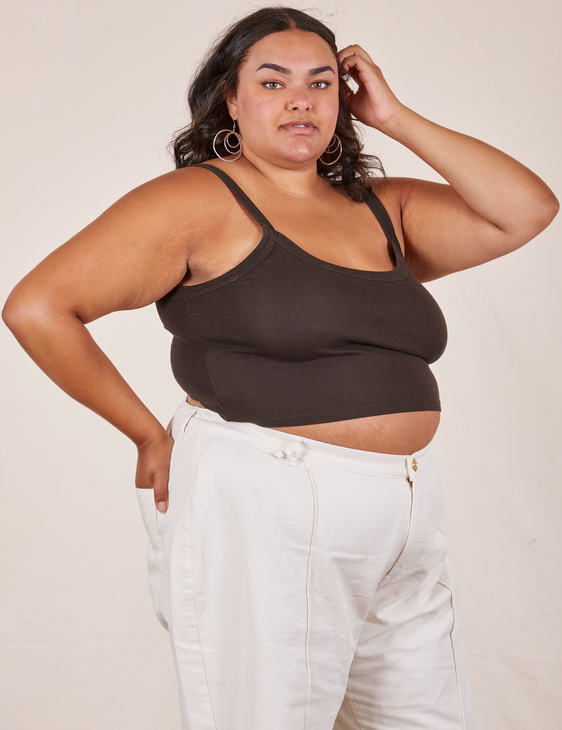 Angled view of Cropped Cami in Espresso Brown and vintage off-white Western Pants worn by Alicia