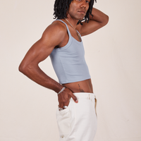 Side view of Cropped Cami in Periwinkle and vintage off-white Western Pants worn by Jerrod