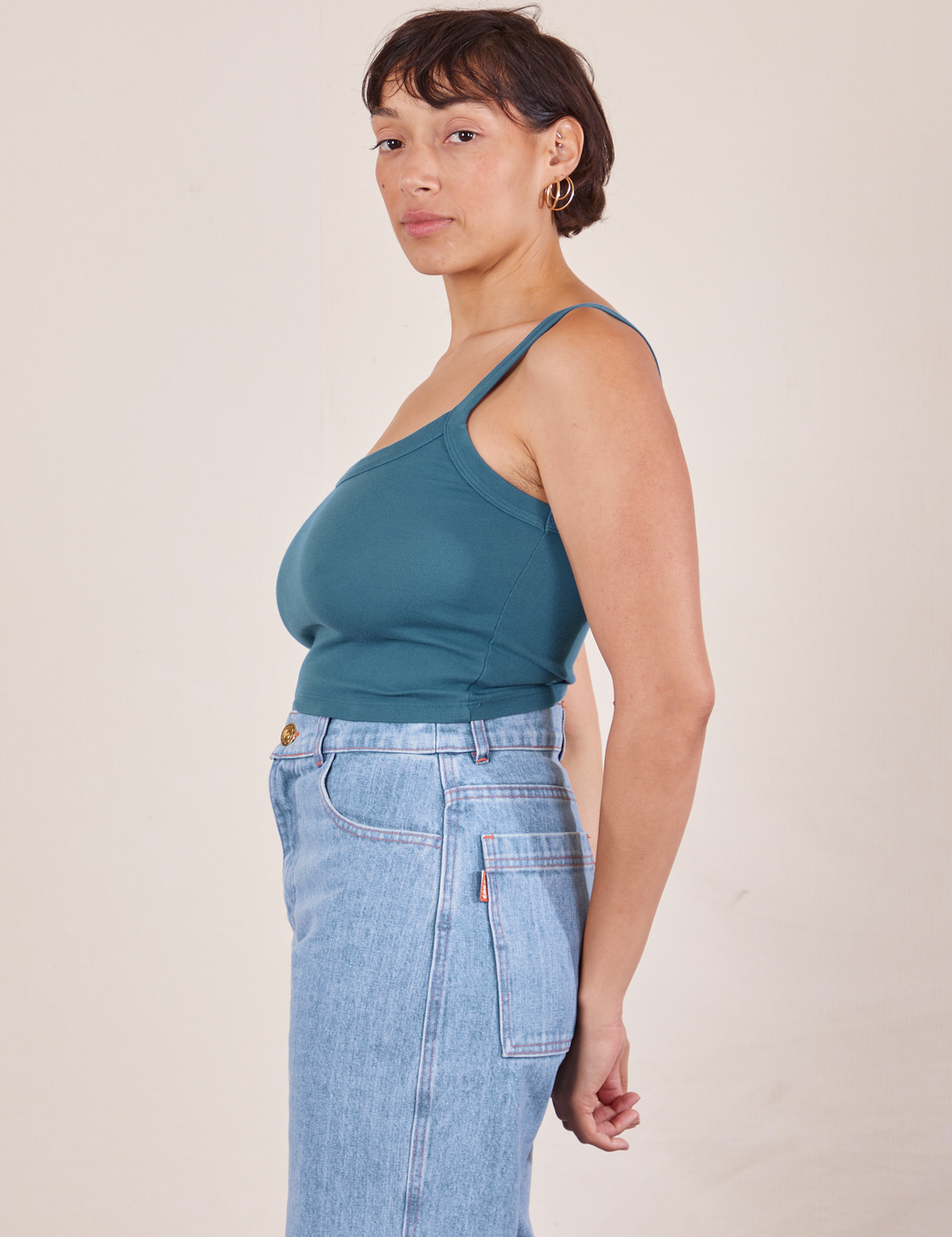 Side view of Cropped Cami in Marine Blue and light wash Sailor Jeans worn by Tiara