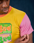 Vintage Tee in Bubblegum front shoulder close up with Isaac touching pink sleeve