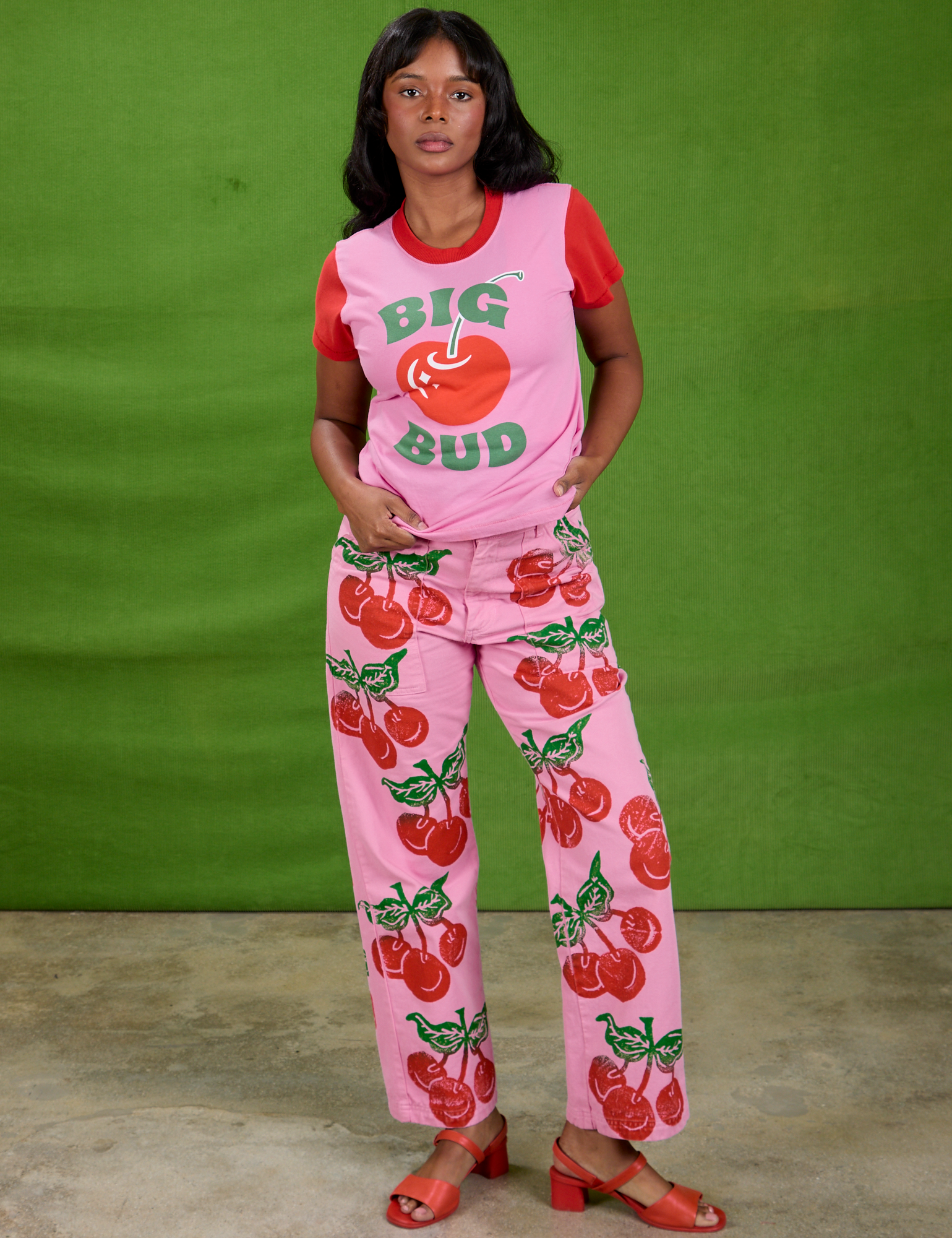 Kandia is wearing Cherry Paintstamped Work Pants in Bubblegum Pink and the Vintage Tee in Big Cherry