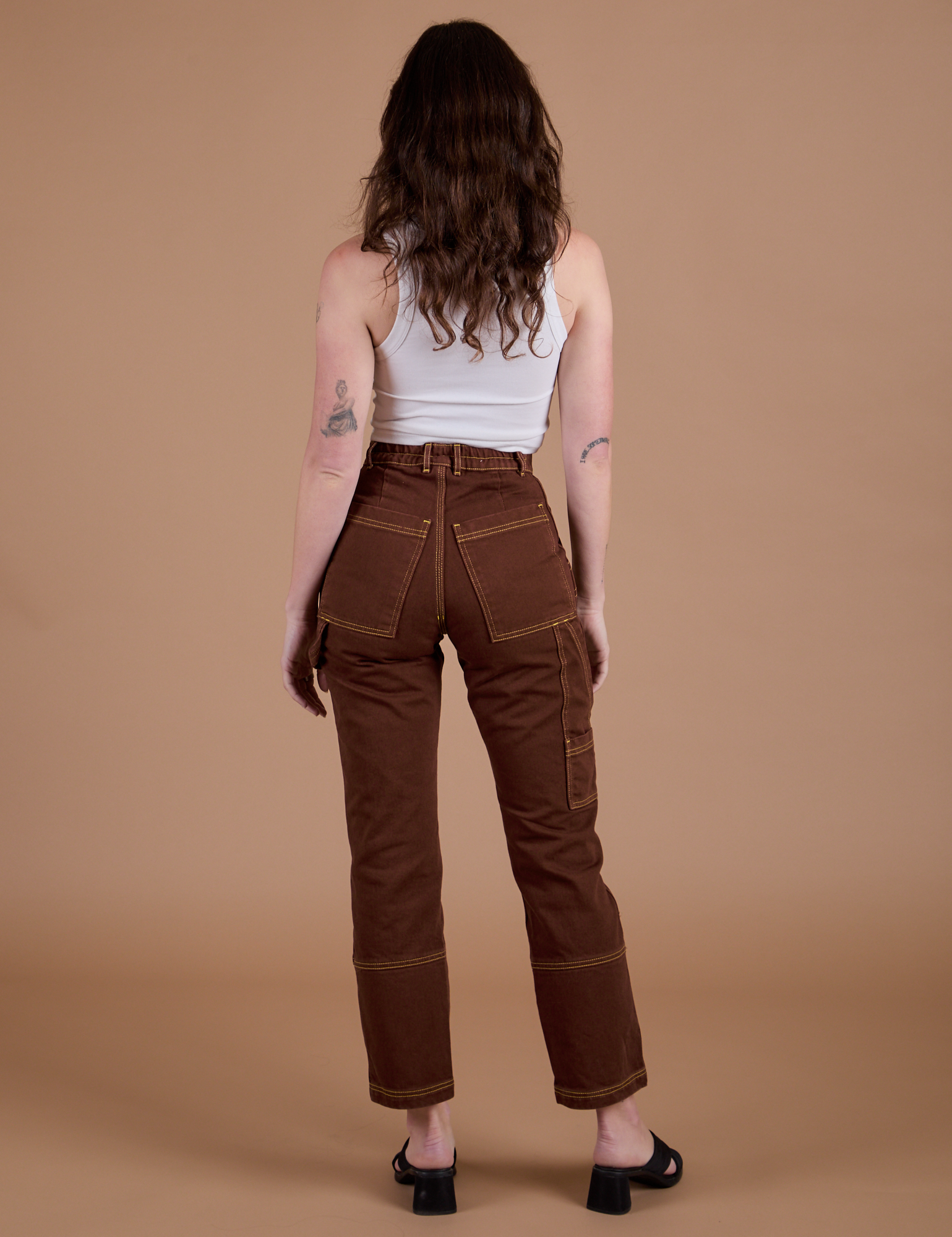 Carpenter Jeans in Fudgesicle Brown back view on Alex