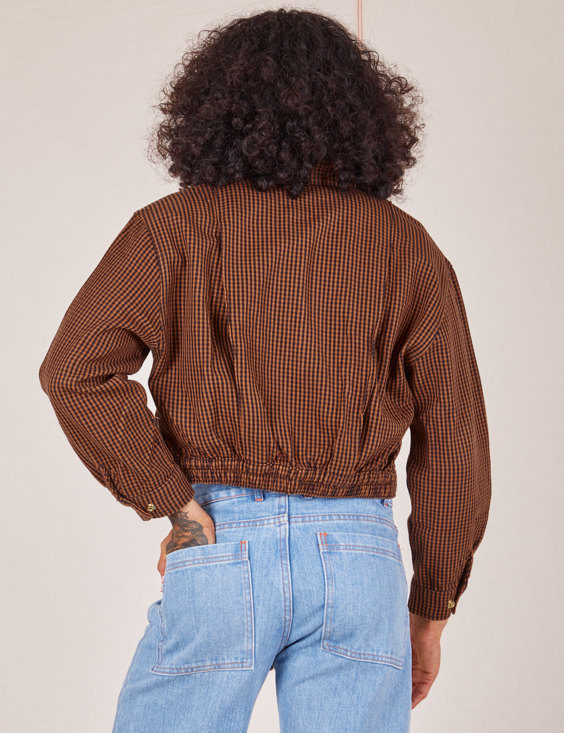 Back view of Ricky Jacket in Brown Checker worn by Jesse