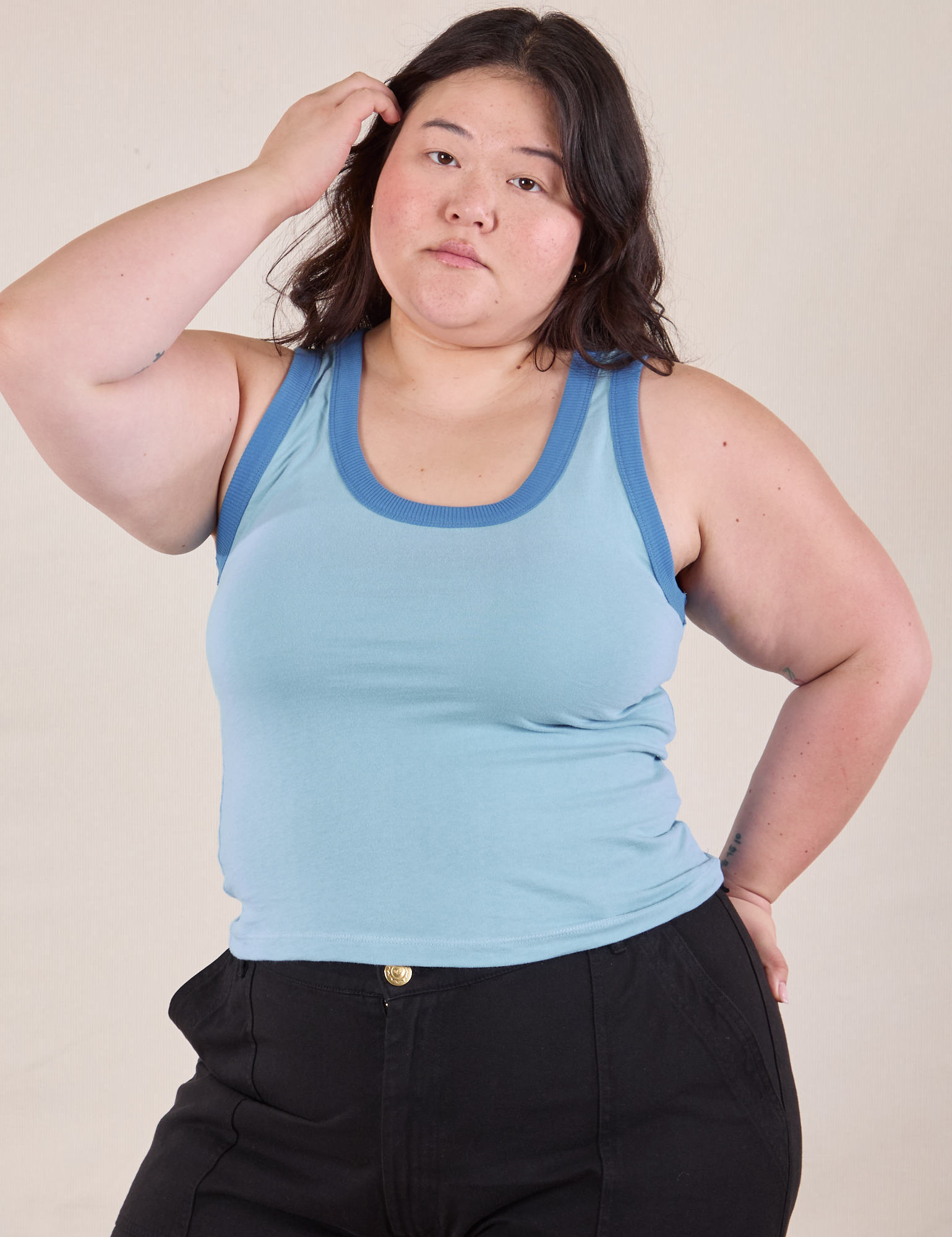 Ashley is 5&#39;7&quot; and wearing L Colorblock Cropped Tank in Baby Blue