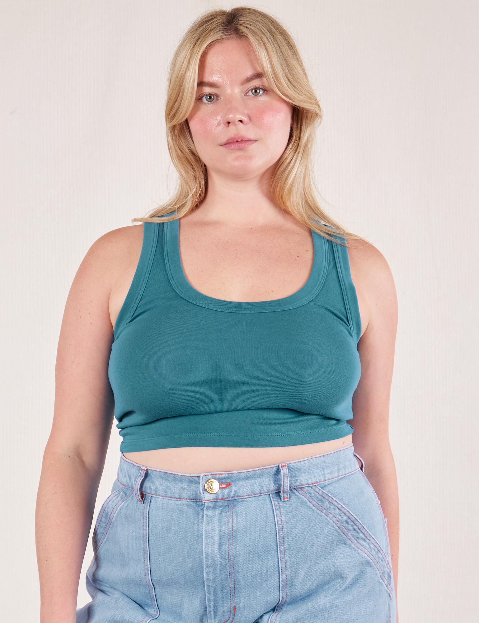 Lish is 5&#39;8&quot; and wearing S Cropped Tank Top in Marine Blue