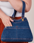 Dark Wash Indigo Overall Handbags worn on arm of model