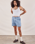 Jesse is 5'8" and wearing S Denim Trouser Shorts in Light Wash paired with a Cropped Tank in vintage tee off-white