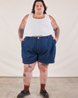 Sam is 5'10” and wearing 3XL Denim Trouser Shorts in Dark Wash paired with a Cropped Tank in vintage tee off-white