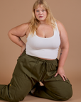 Drop Pocket Cargo Pants in Surplus Green and Cropped Tank in Vintage Tee White worn by Juliet