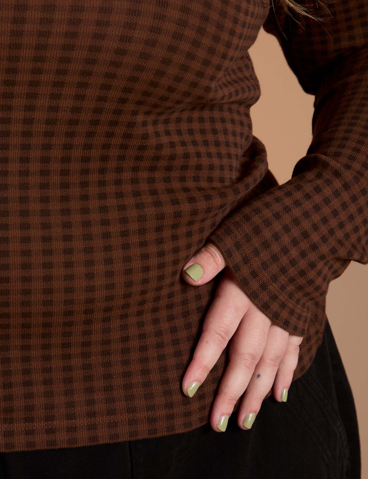 Close up Long Sleeve Baby Tee in Fudgesicle Brown bottom on Juliet