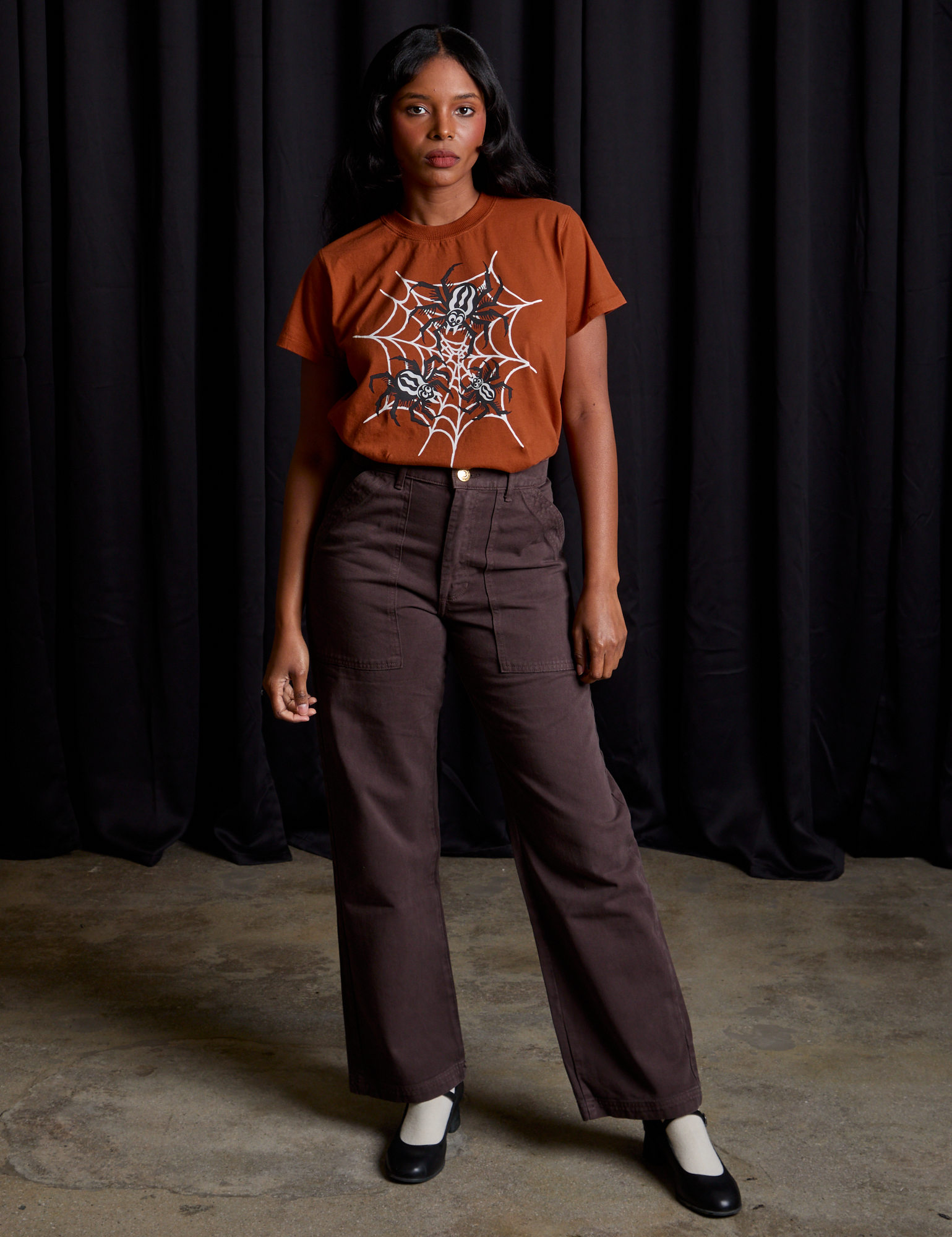 Kandia is wearing Vintage Tee in Spidey and espresso brown Work Pants