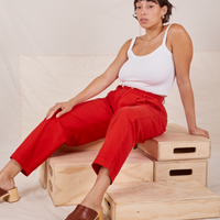 Tiara is wearing Heavyweight Trousers in Mustang Red and vintage off-white Cropped Cami