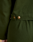 Close up of brass side snaps on Heritage Mechanic Jacket in Evergreen