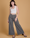 Alex is 5'8" and wearing XXS Heritage Wide Leg Trousers in Washed Grey paired with a vintage tee white Cropped Tank