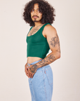 Angled view of Cropped Tank Top in Hunter Green worn by Jesse