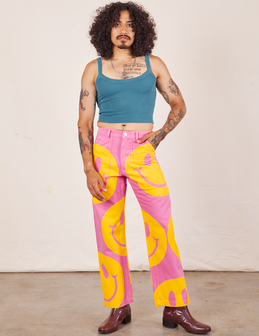 Jesse is 5'8" and wearing XS Icon Work Pants in Smilies paired with. marine blue Cropped Cami