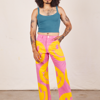 Jesse is 5'8" and wearing XS Icon Work Pants in Smilies paired with. marine blue Cropped Cami