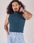 Jesse is 5'8" and wearing S Sleeveless Essential Turtleneck in Lagoon